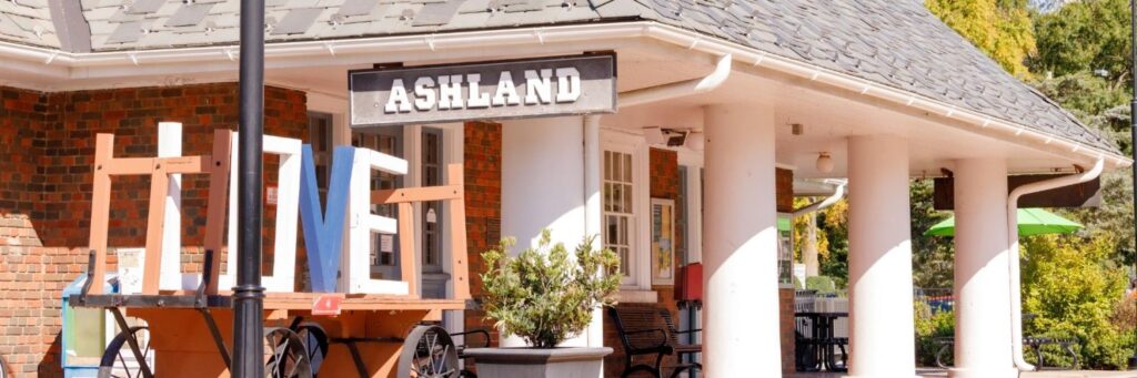 ashland train station with love sculpture in front of the ashland sign